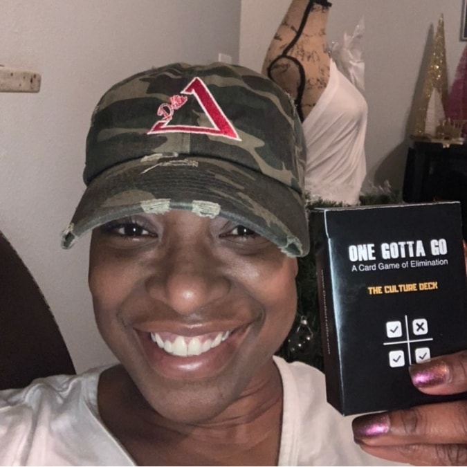 Smiling customer holding The Culture Deck